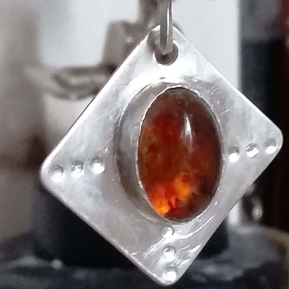 Handmade sterling silver bezel set amber pendant