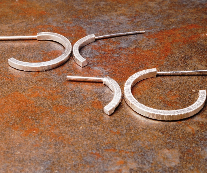 Polished and textured handmade sterling silver hoops