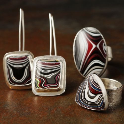 Handcrafted sterling silver Fordite earring and rings