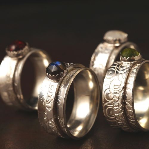 Handcrafted recycled stamped sterling silver healing crystal spinner rings