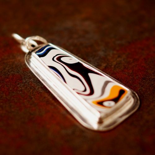 Handcrafted recycled sterling silver trapezoid Fordite pendant front