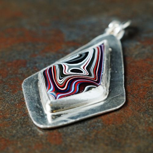 Handcrafted recycled sterling silver kite Fordite pendant