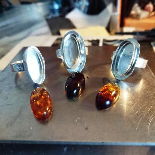 Handcrafted sterling silver Baltic oval amber settings