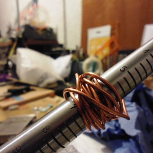 Recycled Copper wire wrapped around ring mandrel to create ring shape