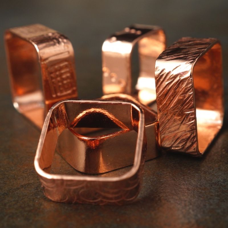 Handcrafted textured and stamped square recycled copper rings