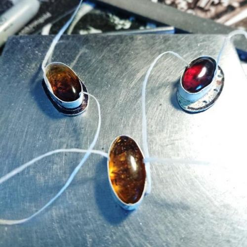 Handcrafted sterling silver Baltic oval amber settings